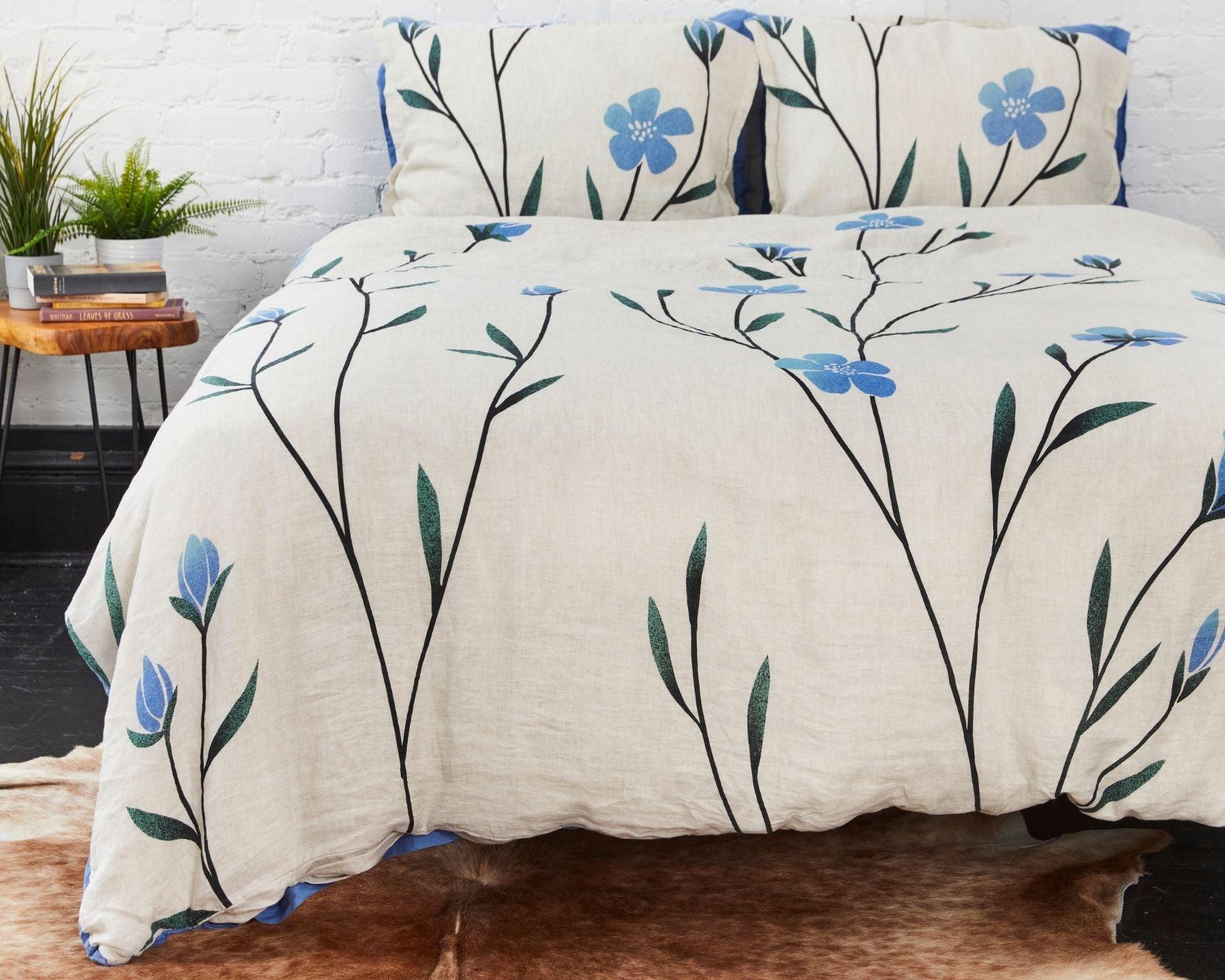 Organic European linen duvet cover on natural flax linen with Scandinavian floral design featuring blue flowers 